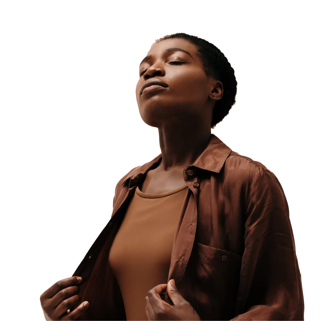 A person with their eyes closed, head tilted back slightly with a calm expression as if breathing deeply through their nose.